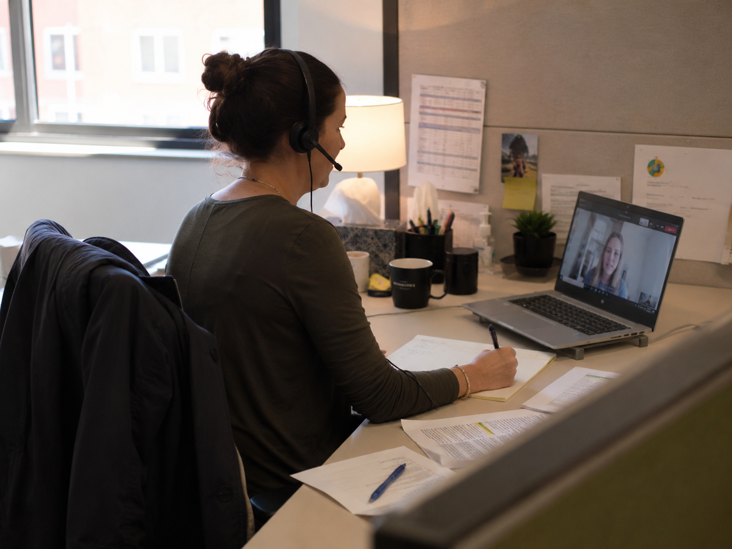 Colleagues reviewing a laptop together